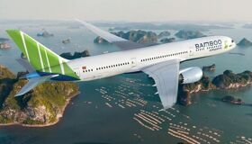Soar above Vietnam’s emerald waters en route to Laos